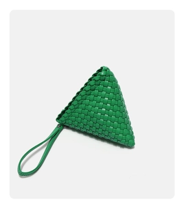 Detailed close-up of green woven leather triangle bag with Intrecciato pattern and wristlet