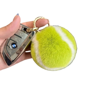 Fluorescent yellow faux rabbit fur tennis ball keychain with gold metal buckle