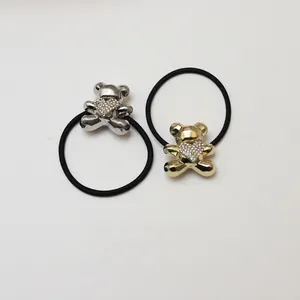 Minimalist bear hair ties with metallic finish and rhinestone hearts in gold and silver