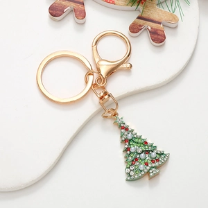Golden Christmas tree keychain with colorful rhinestones and pearls on a white background