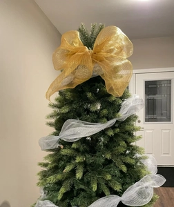 Detail of gold festive bow and silver mesh ribbon used for Christmas tree DIY decoration