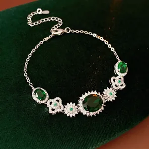 Vintage emerald zircon flower bracelet with green stones and silver floral metal links