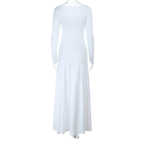 Detail view of the pleated white maxi skirt back on a tailored long-sleeve dress