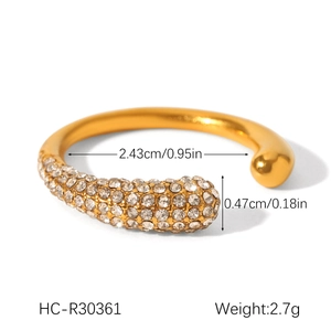 Macro view of gold stainless steel ring with zircon heart and size measurements