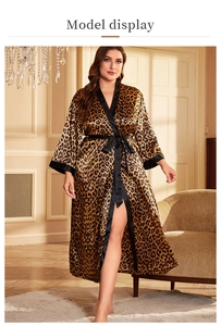 Detailed view of leopard print satin robe with black trim and elegant tie-waist belt