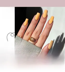 Glossy yellow ballerina press-on nails set with #JP2081 design and a gold mesh ring accessory