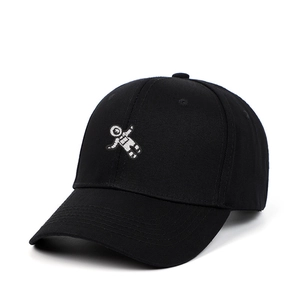 Classic black cotton baseball cap with white astronaut embroidery from a 45-degree angle