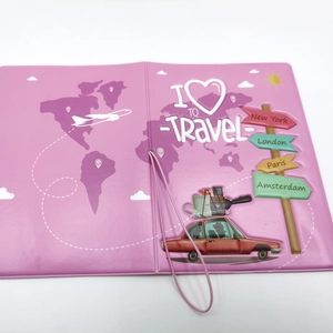 Pink leather passport holder featuring world map illustrations and elastic closure band