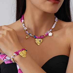 Boho heart necklace and bracelet set with pink floral fabric and gold pendants