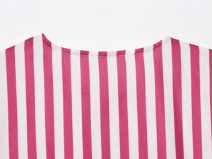 Macro shot of red and white striped fabric texture and round neckline stitching details