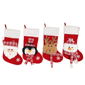 Set of 4 Christmas stockings with Santa, snowman, penguin, and reindeer patterns