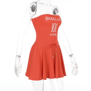 Detail of orange tube dress with Parklan 101 letter print and waist drawstring ties