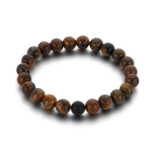 Elastic tiger eye stone bead bracelet with a matte black agate accent on a white background
