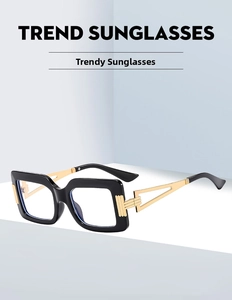 Detail view of square sunglasses featuring hollow gold metal temples and black frame