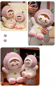Detail of peach girl plush toy showing soft pink velvet texture and embroidered facial expression