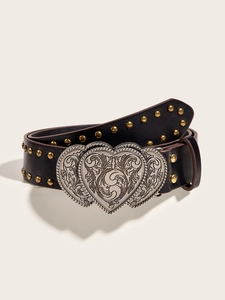 Detail of black punk leather belt featuring golden studs and heart-shaped silver buckle