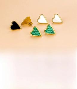 Detail view of heart-shaped stainless steel earrings with color inserts and 1.6g weight