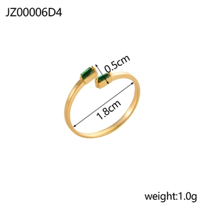 Detail view of gold adjustable ring showing dimensions 1.8cm diameter and green gems