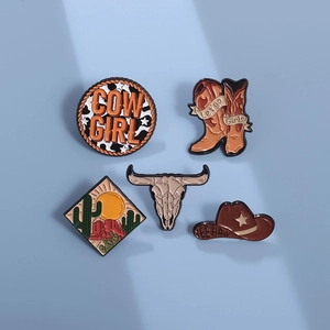 5-piece western cowboy enamel pin set with boots, hat, cow skull, and cactus motifs
