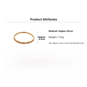 Detail view of gold heart bracelet made of copper and zircon with fine craftsmanship