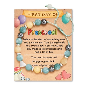 Detail of beaded heart bracelet on 'First Day of Preschool' gift card with message