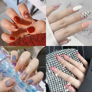 Detailed collage of press-on nail sets featuring festive red and minimalist zebra patterns