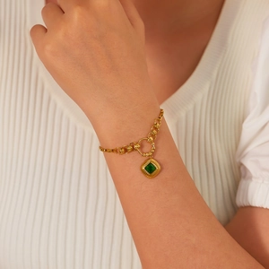 French vintage style stainless steel bracelet with green square zircon on wrist
