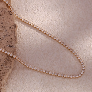 Detailed macro view of 14K gold plated tennis necklace with dense zircon micro-paving
