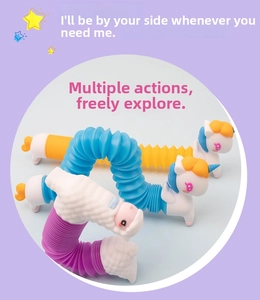 Close-up of colorful pop tube unicorn and sheep toys with flexible plastic bellows