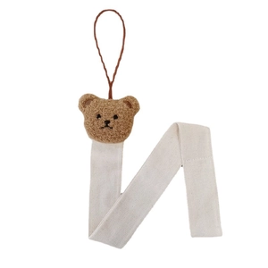 Plush brown bear head hair accessory organizer with woven cotton hanging strap