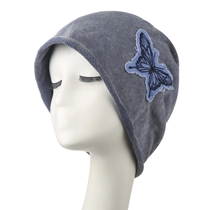Retro grey-blue washed denim knit hat with a frayed butterfly embroidery patch for women