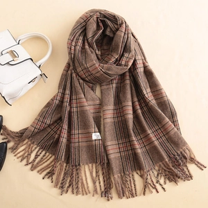 Classic brown plaid cashmere scarf with fringes shown in a stylish flat lay arrangement