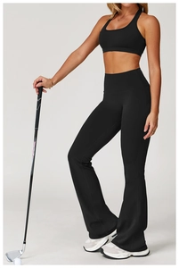 Detail of high-waisted black yoga flares and racerback top with premium matte finish