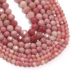 Close-up of pink faceted natural stone loose beads for DIY jewelry making and crafts