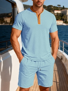 Detail of light blue waffle knit summer set showing fabric texture and button collar design