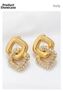 Detail view of gold-plated double hoop earrings with cubic zirconia and ribbed texture