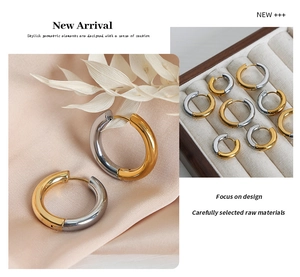 Detail of two-tone gold and silver hoops on pink silk with elegant floral accents