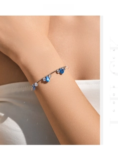 Details von s925 Silberarmband mit blauen Tropfensteinen und funkelnden Zirkonias