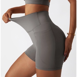 Close-up of high-waist yoga shorts showing side pockets and high elasticity fabric