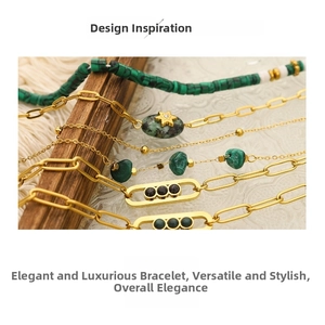 Close-up of gold bracelets set with green malachite stones and charms on wood