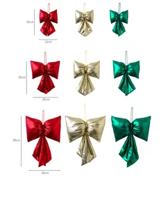 Detailed size chart for Christmas bow ornaments in red, gold, and green metallic finishes
