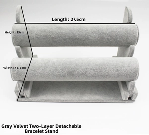 Close-up of a two-tier grey velvet jewelry stand for bracelets and watches display