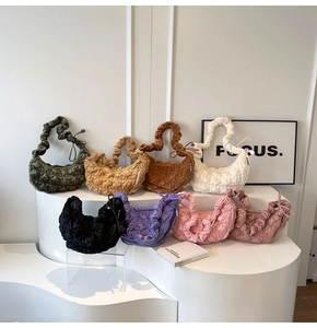Quilted velvet cloud bags displayed in multiple colors on a minimalist white stage