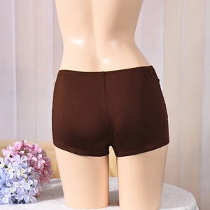 Detail view of dark brown low-waist booty shorts with metal accents on stretchy fabric