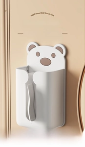 Wall mounted white bear tissue box with easy-to-use opening on a cream wall