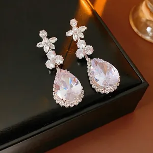 Luxury zircon flower earrings with pear-shaped water drop pendants on black leather