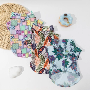 Hawaiian pet shirts for dogs featuring tropical palm leaves and floral prints on light fabric