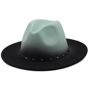 Detail of wool fedora hat with green gradient finish and studded leather band