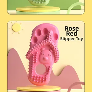 Detail of rose red slipper-shaped dog chew toy with textured teething surface bumps