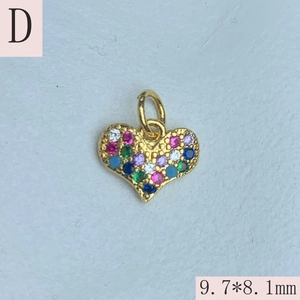 Detailed macro view of heart-shaped gold charm with rainbow cubic zirconia 9.7x8.1mm